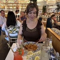 View of restaurant, half-eaten pasta bolognese.  at Basta in Stockholm