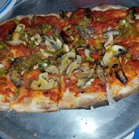 Dragon Fired Pizza, no cheese with all the veggies. A little pricey because it's a small portion ($18) but very happy to have the option! at Lou's Blues Bar & Grill in Indialantic