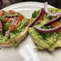 Avocado bagel toast with vegetable toppings and everything seasoning   at Lee's Coffee & Tea in Laurel