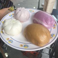 Taro bun, mushroom bun (small ones), Japanese potato bun and brown sugar bun with no filling  (big ones) at Pun-Pao Steamed Buns in Chiang Mai