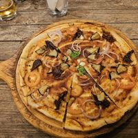 The "Not So Vegan" pizza made vegan. at Hermit's Restaurant in Dhigurah