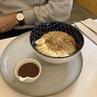 Pumpkin spiced porridge with banana and chocolate sauce (special)  at Balino Yoga Café  in Sevilla
