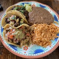 top->bottom: carne asada, al pastor, and pollo with beans and rice😍  at Sugar Taco in Long Beach