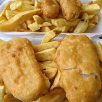 Battered vegan sausages and fish, with fresh chips at The Front Fish and Chips in Newbiggin-by-the-sea