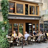 A brass band played across the street when we dined, so we had a show with our outdoor dinner.   at Le Grenier de Notre Dame in Paris