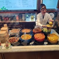 Dishing up our curry bowl at Le Botaniste - Bryant Park in New York City