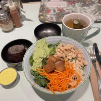 Salad base with 4 add-ons: carrots, white bean salad and tofu good but green pea chumus is sweet and not in a good way. Aioli dressing good.  at Le Botaniste - Bryant Park in New York City