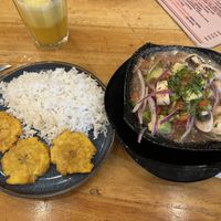 Ceviche with Patacones and rice 🍚   at Fer's Grill House in Puerto Baquerizo Moreno