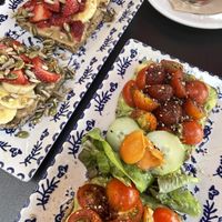 avocado, cherry tomatoes and zataar and the other one is the tahini, miso, toasted seeds, fresh fruits. Both with buckwheat bread so it was gluten free  at DODO in Mallorca