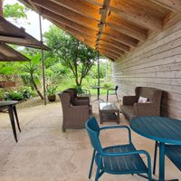 Outdoor seating area with bar at Nuchigusa Cafe in Ishigaki
