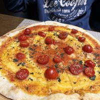 Veganized Margarita. Looks boring, but actually it's not. Thin crispy dough and mouthwatering sauce with fresh garlic make magic things. at Jean's Bistro in Yerevan