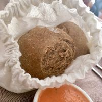 beautiful hand made bread served in a soft cotton pouch. to keep them warm at Quinoa in Las Condes
