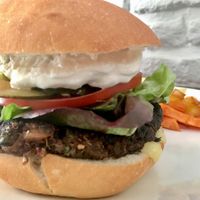 quinoa burger with Yukon gold and sweet potato fritas at Quinoa in Las Condes