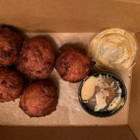 Hush puppies with chipotle-brown sugar butter dipping sauce to go at the HOOT in Columbia