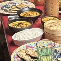 (Poor image) but red rice, coconut roti, cashew curry, lotus curry, and lentil curry. String hoppers in basket.   at Machan Kitchen in Croydon