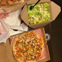Vegan pizza, vegan zepolli’s (doughnuts) and vegan Caesar salad   at Slice of Vegas Pizza in Las Vegas
