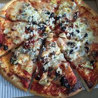 Build your own pizza with black olives, sun-dried tomatoes and artichokes, vegan cheese at Roberts Street Pizza in Ladysmith