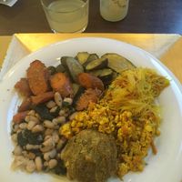 A choice in the buffet, veggies, rice noodle and scramble tofu at Cibó Vegan Food in Milan