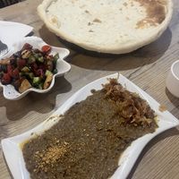 Freshly baked pita, fattoush salad and a roasted eggplant dip with crispy fried onions   at Bonu Resturan in Dushanbe