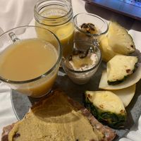 My breakfast, consisting of ginger, shots, mango, soya milk, smoothie, overnight oats, and fresh fruit. at Blique by Nobis in Stockholm