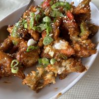 Fried veggies in mild sauce  at Momo Factory Davie in Vancouver