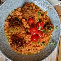 Lentil and green pea patties, basil-tomato bulgur, roasted cherry tomatoes at Pannónia Restaurant in Szombathely