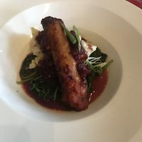 Italian Sausage (only available at dinner) with Beyond sausage, risotto, roasted tomato sauce, and spinach   at By Word of Mouth in Big Sky