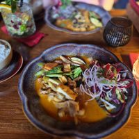 Red curry in coconut milk with tofu and seitan served with rice at Padme Hum  in Munich