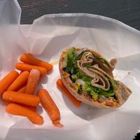 Wheat wrap, hummus, with all the veggies and carrots for the side.   at Ohiopyle Bakery & Sandwich Shoppe in Ohiopyle