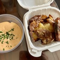 CRISPY SMASHED SALT POTATOES - make sure to ask them to substitute vegan mayo for the cherry pepper mayo sauce   at Vine and Fig in Rome