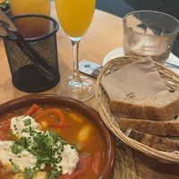 A Shakshuka that tastes of home wherever you're from, mimosa and lemonade.   at Morgentau. in Barcelona