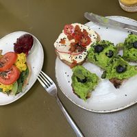 Curried chickpea bagel; toast two ways (tofu cream cheese and pea-guac)  at Morgentau. in Barcelona