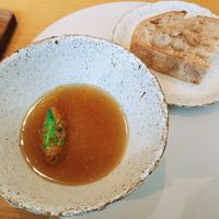 Vegetable soup with a slice of sourdough bread at Legume Seoul in Seoul