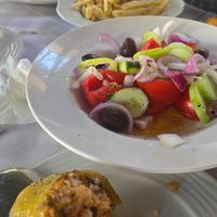 Rice stuffed peppers, French fries and Greek Salad minus the feta! at Taverna To Paramithi in Kalampaka