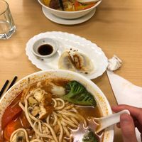 Tom yum noodles in the front, laksa in the back, and dumplings  at Aunty Mena's in Wellington