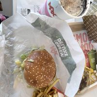 Super tasty chicken sandwich with spicy buffalo sauce + mayo on both the burger and on the side. Delicious chocolate and vanilla milkshake and a side of fries at MAX - Aspögatan in Linkoping
