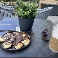 Poffertjes und Café Latte mit Hafermilch  at Zand & Zee Cafe Lounge in Binz