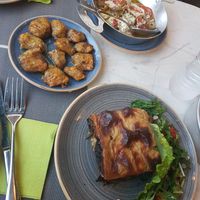 Stuffed Zucchini flowers, vegan Mousaka and vegetarian roasted feta at Hamam Cafe in Rhodes