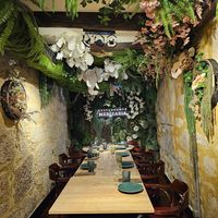 Our jungle-themed table for 9. at Restaurante Mercearia in Porto