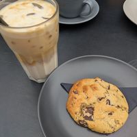 Oat latte and vegan cookie at The Refinery  in Faversham