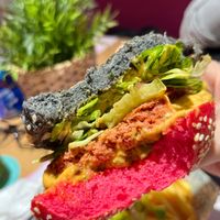 VJFB Cruelty Free Burger: "beeef" on a black/pink bun, cheeze, lettuce, tomato, pickles, VJFB sauce at Vegan Junk Food Bar -  L'Eixample in Barcelona