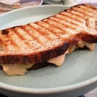 Melting cheese (Vegasaura) and onions sandwich at Dale Café  in Madrid