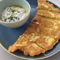Chickpea socca with rosemary and garlic bean purée  at The Lost Kitchen in Tiverton