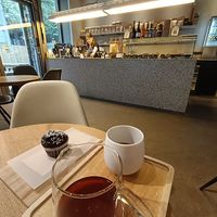 Filter coffee and a small muffin at The Barn Roastery in Berlin