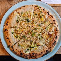 Pizza of the week: Cashew cheese, lemon slices, smoked tofu, almonds, zucchini, lemon thyme, vegan parmesan at NOAH in Mainz