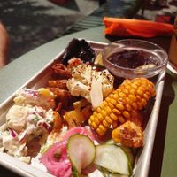 BBQ VEGAN PLATTER – Single

Home smoked tofu, corn ribs, smoked portobello, grilled pineapple and cauliflower, black beans, potato salad, coleslaw, & pickles! at Krøl in Malmo