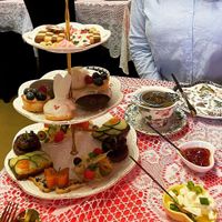 Three-tiered cake stand with sweet and savory vegan bites  at Queen of Hearts in Henderson