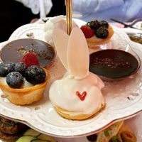Sweet bites including bunny cream puffs, chocolate ganache and berry tarts .  at Queen of Hearts in Henderson