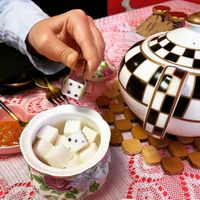 Sugar cubes resembling dice next to teapot .  at Queen of Hearts in Henderson