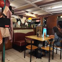 Kitchen with owner behind counter at  夏太熱 Summer Too Hot Pizzatopia in Hualien